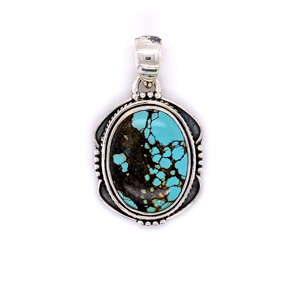 A Super Silver handmade sterling silver pendant with a Natural Turquoise Pendant with an Oval Shield Setting stone.