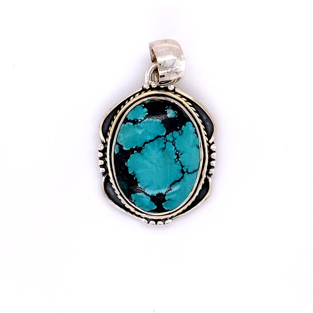 
                  
                    A handmade Super Silver pendant with a Natural Turquoise Pendant with an Oval Shield Setting.
                  
                