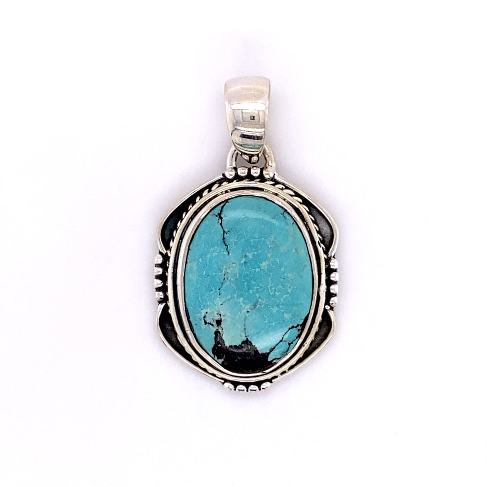 
                  
                    A Natural Turquoise Pendant with an Oval Shield Setting handmade by Super Silver.
                  
                