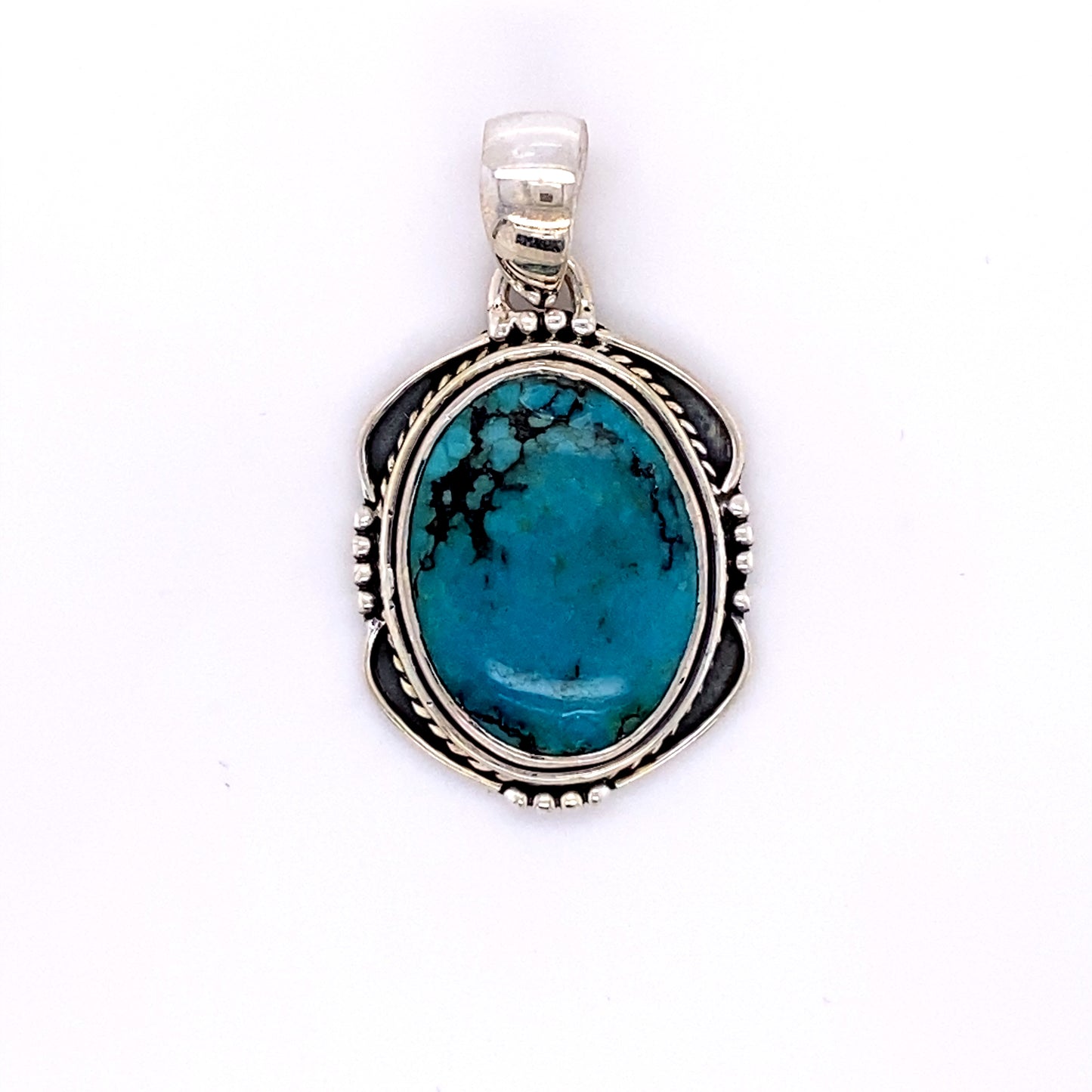
                  
                    A Super Silver Natural Turquoise Pendant with an Oval Shield Setting.
                  
                