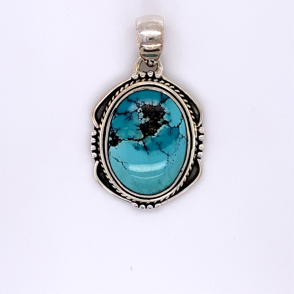 
                  
                    A Super Silver handmade sterling silver pendant with a Natural Turquoise Pendant with an Oval Shield Setting stone.
                  
                
