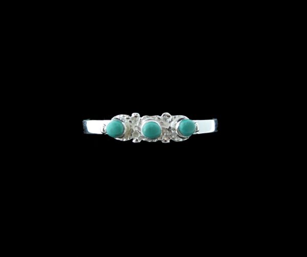 A Super Silver Three Circles Raw Turquoise Ring featuring three raw turquoise pieces on a black background.