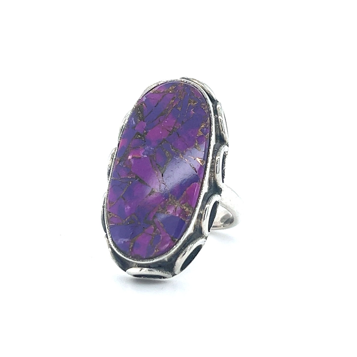 
                  
                    An eye-catching Statement Purple Turquoise Ring from Super Silver, perfect for those looking to make a statement with their accessories. Against the backdrop of a pristine white background, this ring showcases the beauty of composite turquoise in a
                  
                