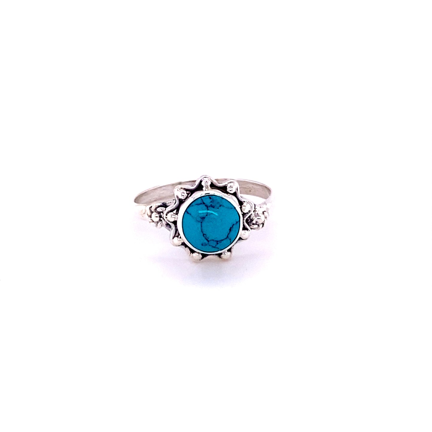 
                  
                    A Flower Ring with Natural Round Gemstone, featuring a stunning cabochon turquoise stone, hippie-inspired in silver.
                  
                