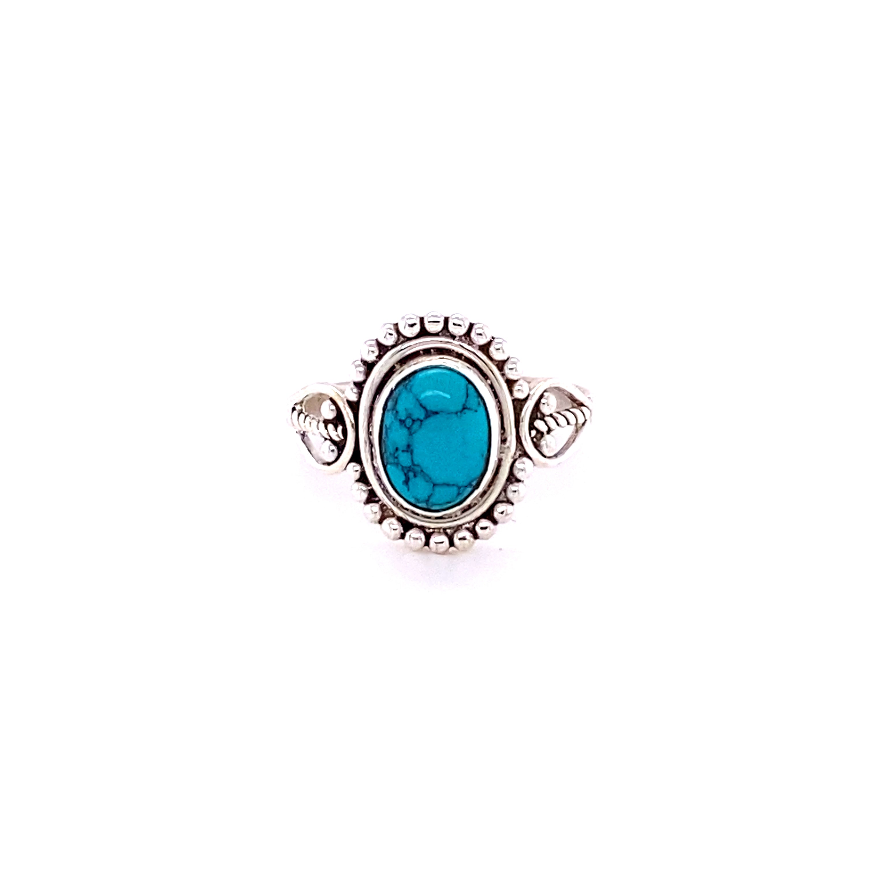 A boho silver ring with an oval gemstone with ball design.