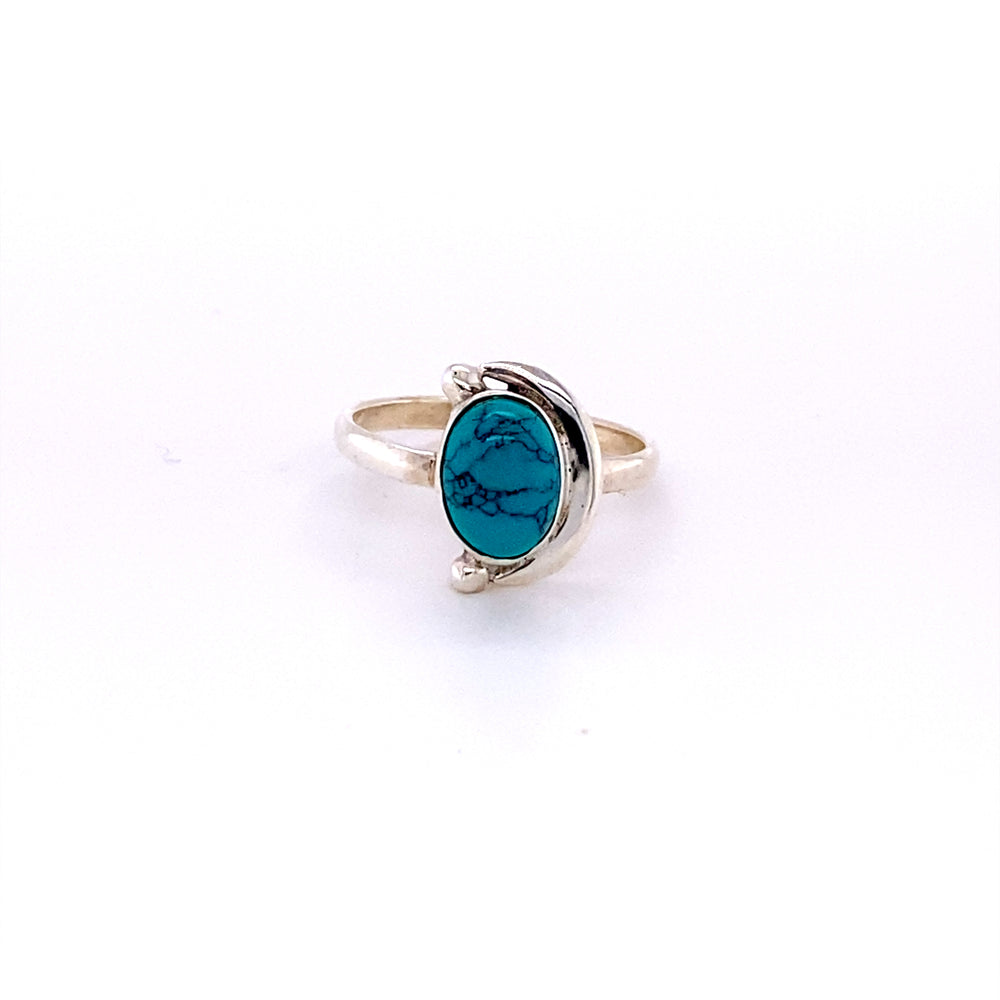 
                  
                    An Oval Crescent Moon Ring with Natural Gemstones bearing a turquoise stone in the middle, perfect for Santa Cruz vibes.
                  
                