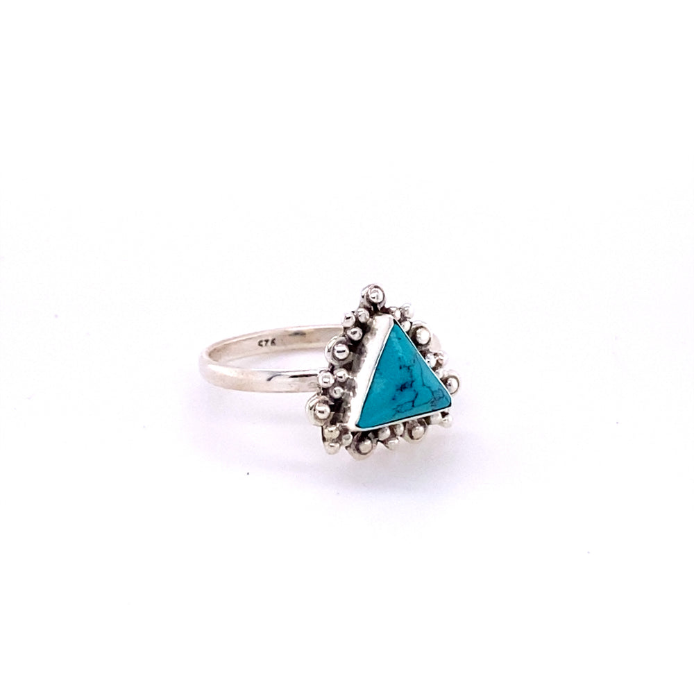 
                  
                    A hippie-inspired Delicate Gemstone Triangle Ring adorned with a beautiful turquoise stone.
                  
                
