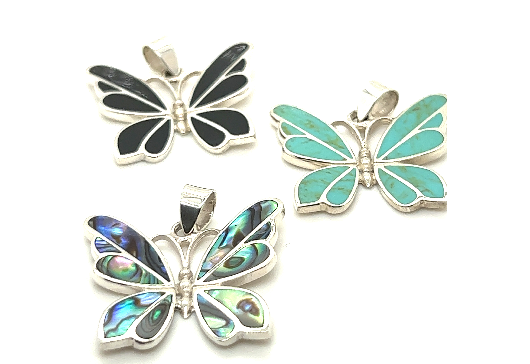 
                  
                    Three Medium Butterfly Pendants with turquoise and abalone stone by Super Silver.
                  
                