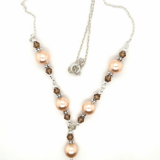 
                  
                    A Super Silver necklace with shell pearls and Swarovski crystals.
                  
                