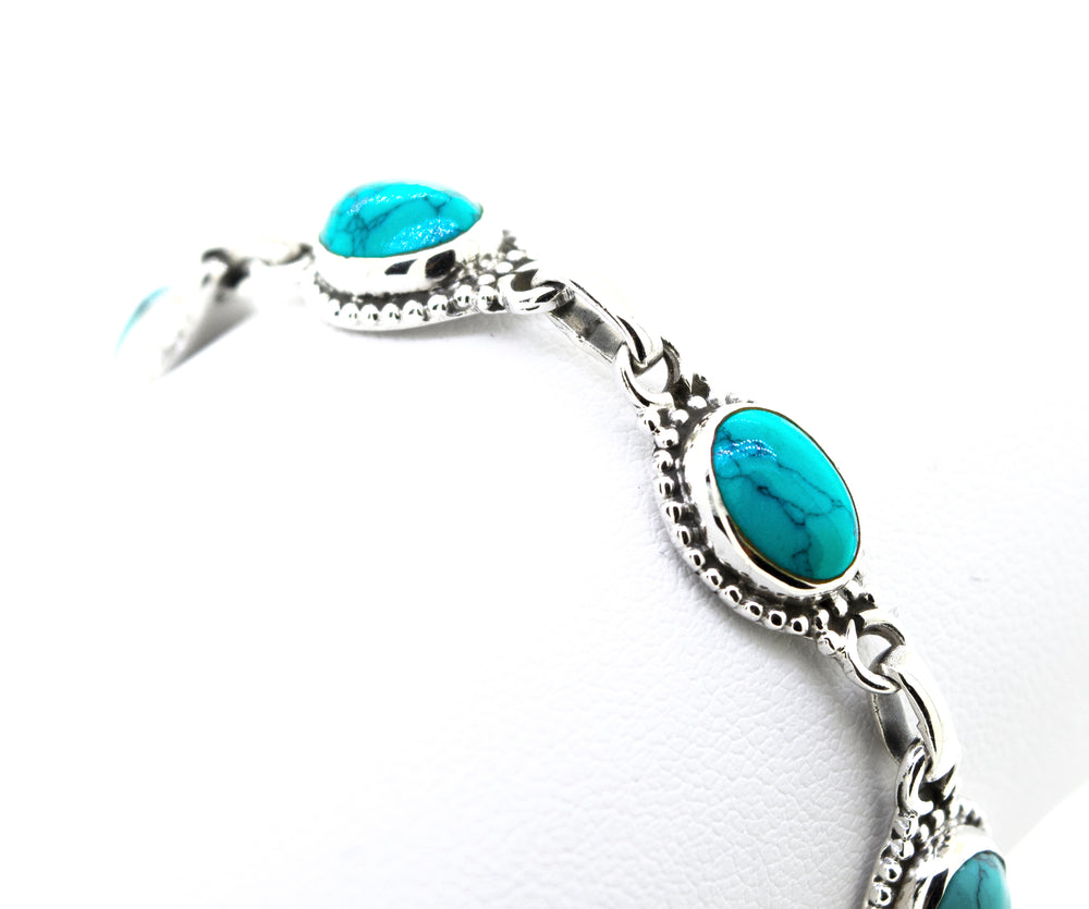 Oval Shape Turquoise Bracelet With Ball Border