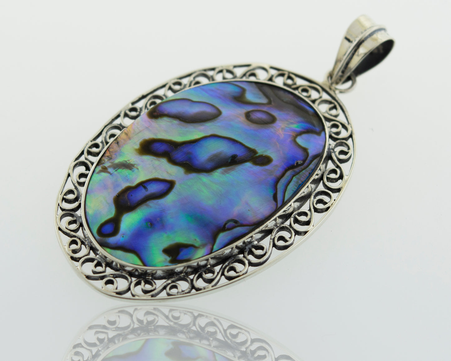 A stunning Oval Abalone Pendant with filigree border in a Super Silver setting.