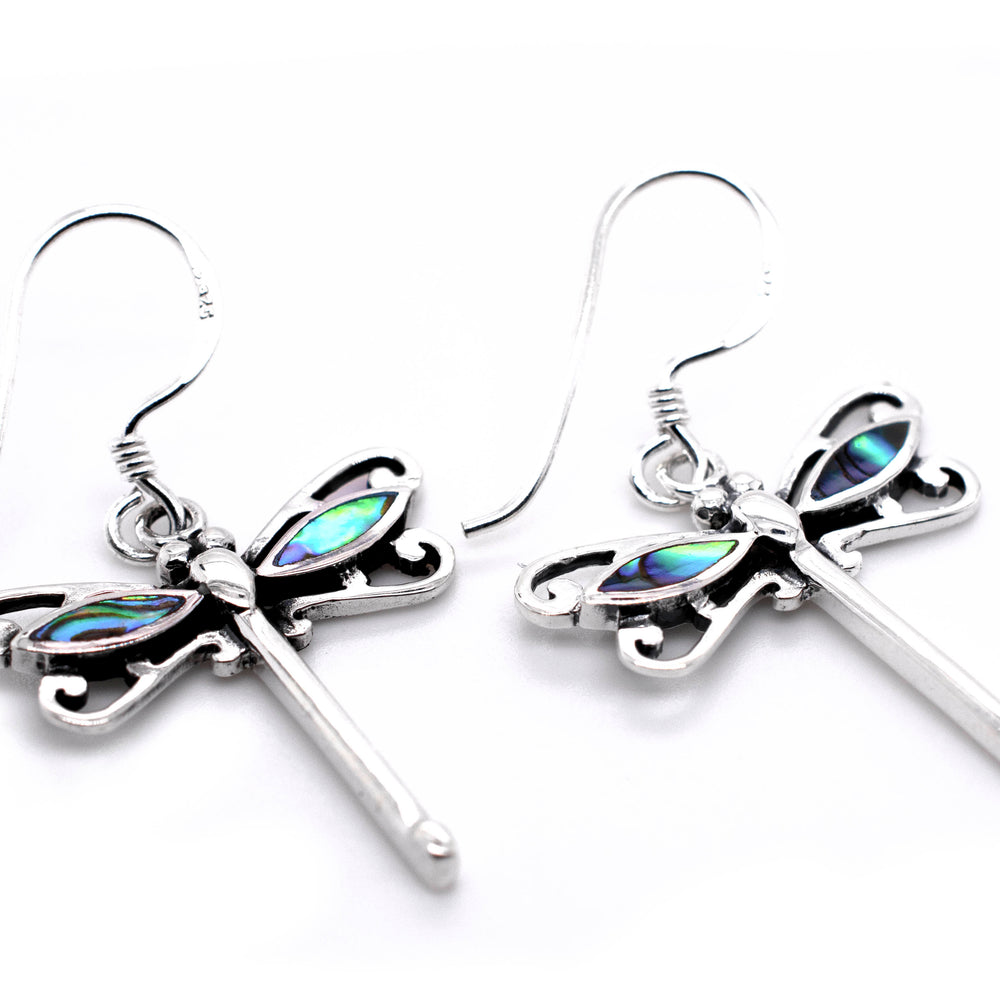 
                  
                    Super Silver Dragonfly Abalone Earrings featuring intricate dragonfly design. These delightful earrings showcase a stunning abalone shell accent, adding a touch of elegance and mystery. Perfect for those seeking patient change with Super Silver Dragonfly Abalone Earrings.
                  
                