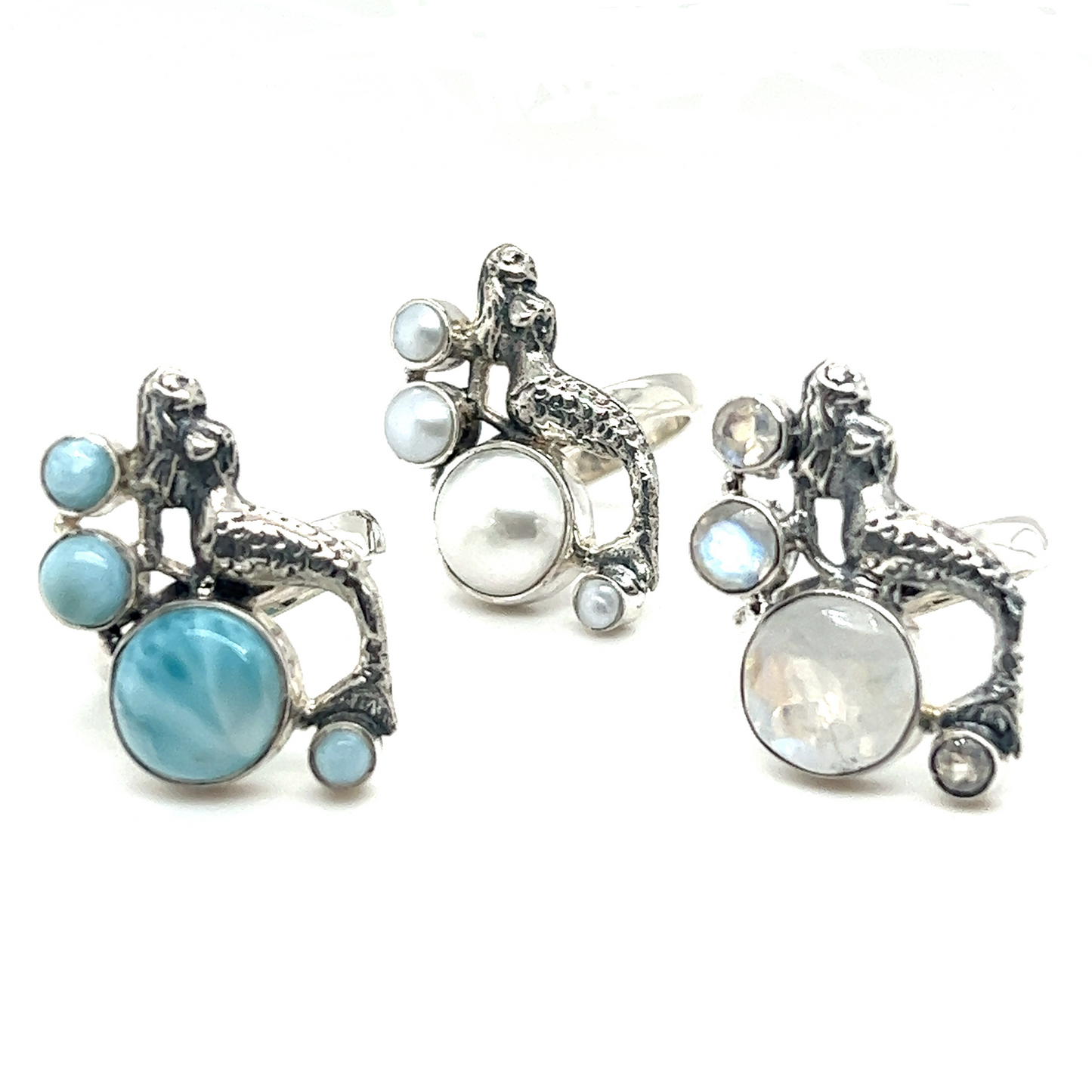 
                  
                    Mythical mermaid ring with pearl adorned with blue and white pearls.
                  
                
