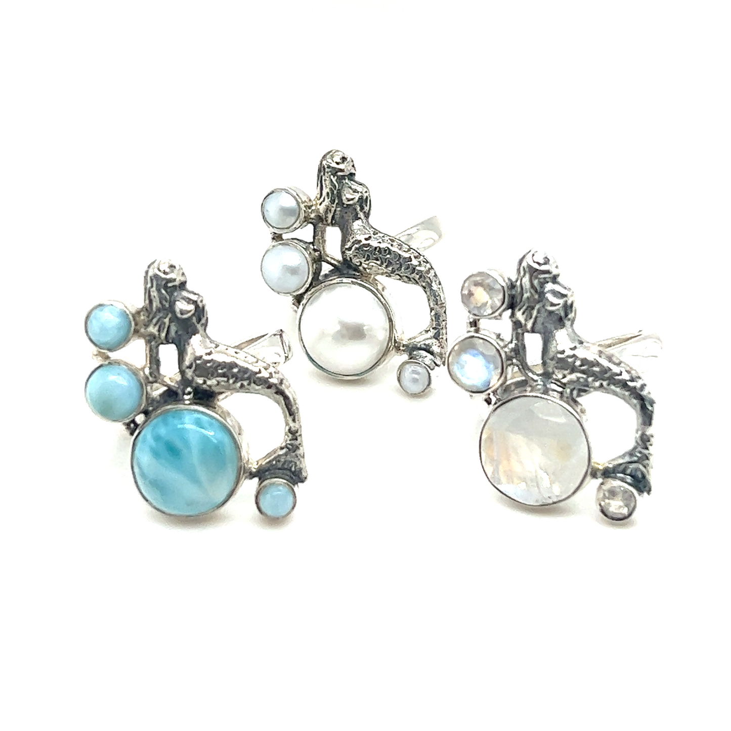 
                  
                    Three mythical mermaid rings with sterling silver and blue pearls.
                  
                