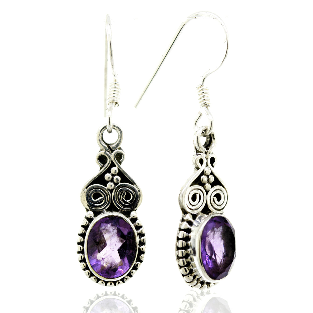 
                  
                    A pair of Super Silver Oval Amethyst Earrings With Ball Border.
                  
                