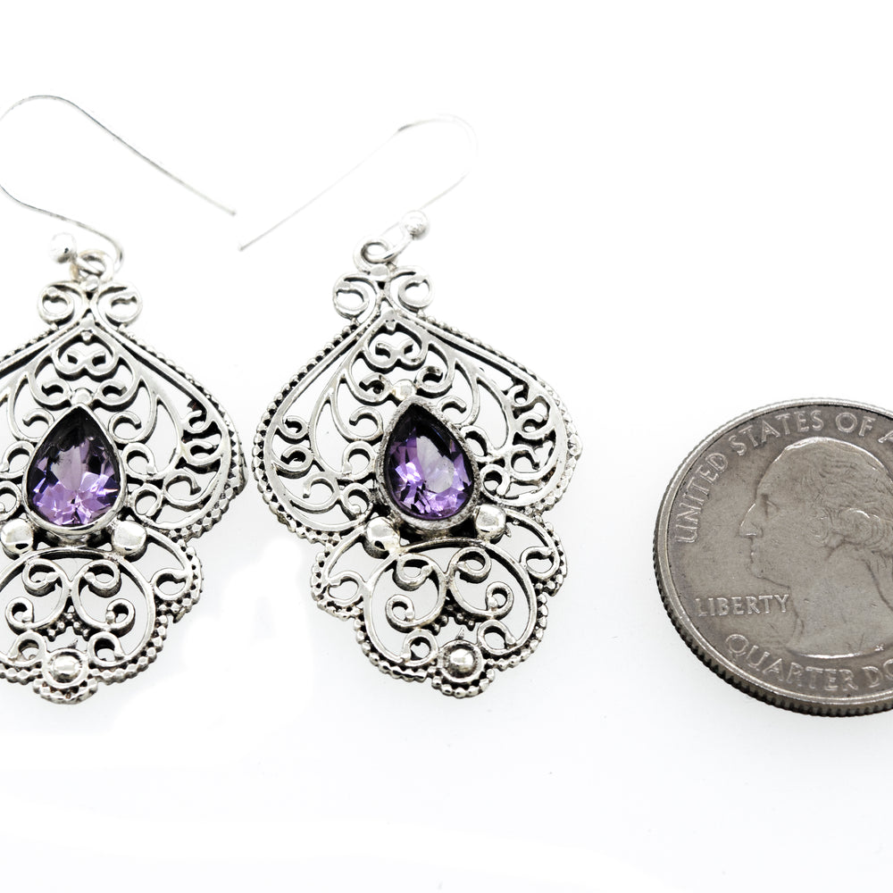 Super Silver teardrop amethyst earrings with freestyle silver design.