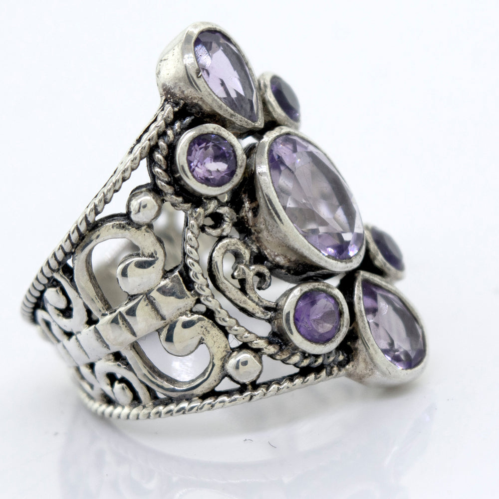 
                  
                    A Super Silver Amethyst Ring With Freestyle Design adorned with amethyst stones.
                  
                