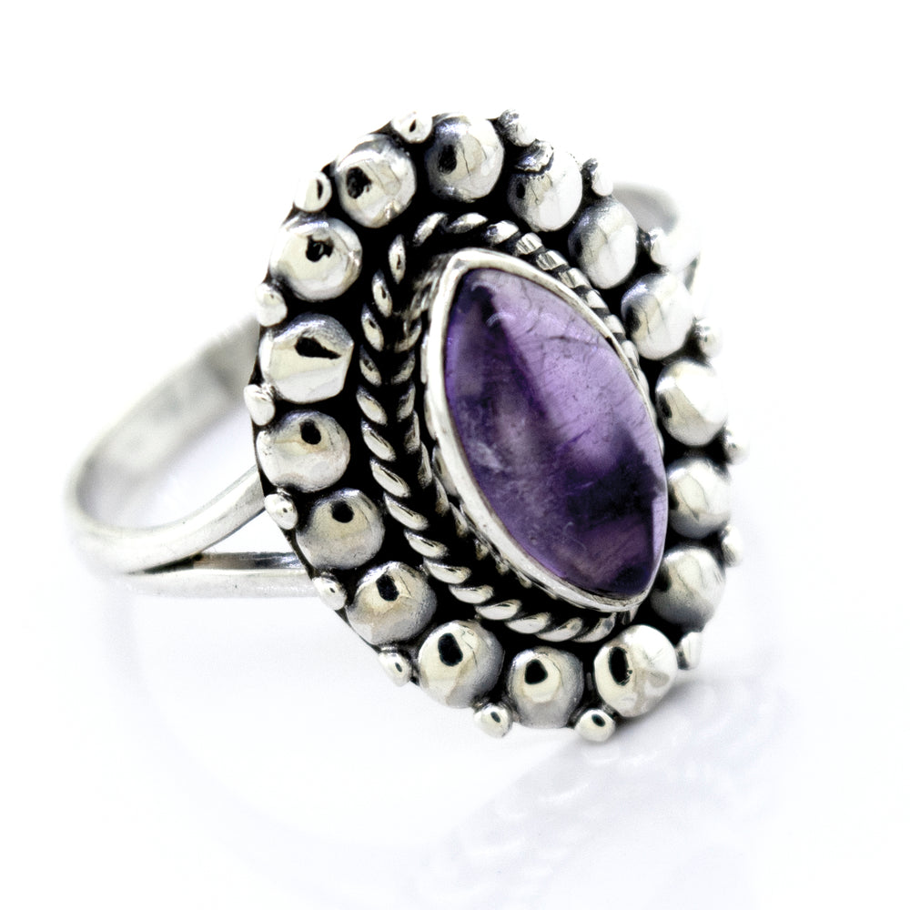 
                  
                    Super Silver Sterling silver ring with a Marquise Shaped Vibrant Amethyst Stone in a silver setting.
                  
                