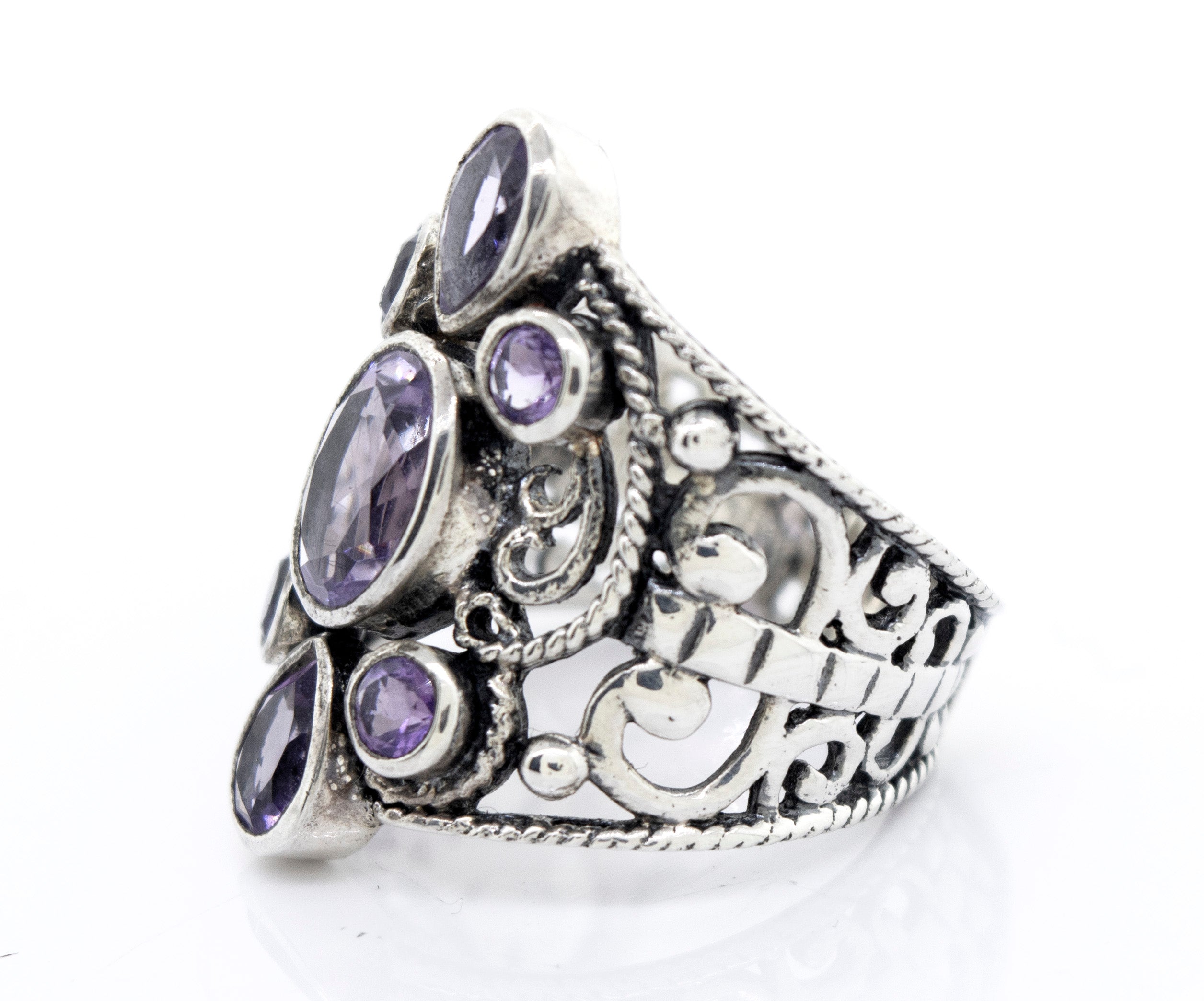 A Super Silver Amethyst Ring With Freestyle Design with amethyst stones.