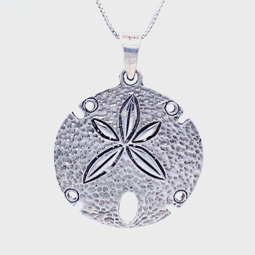 
                  
                    Load and play video in Gallery viewer, Sand Dollar Pendant With Textured Surface
                  
                