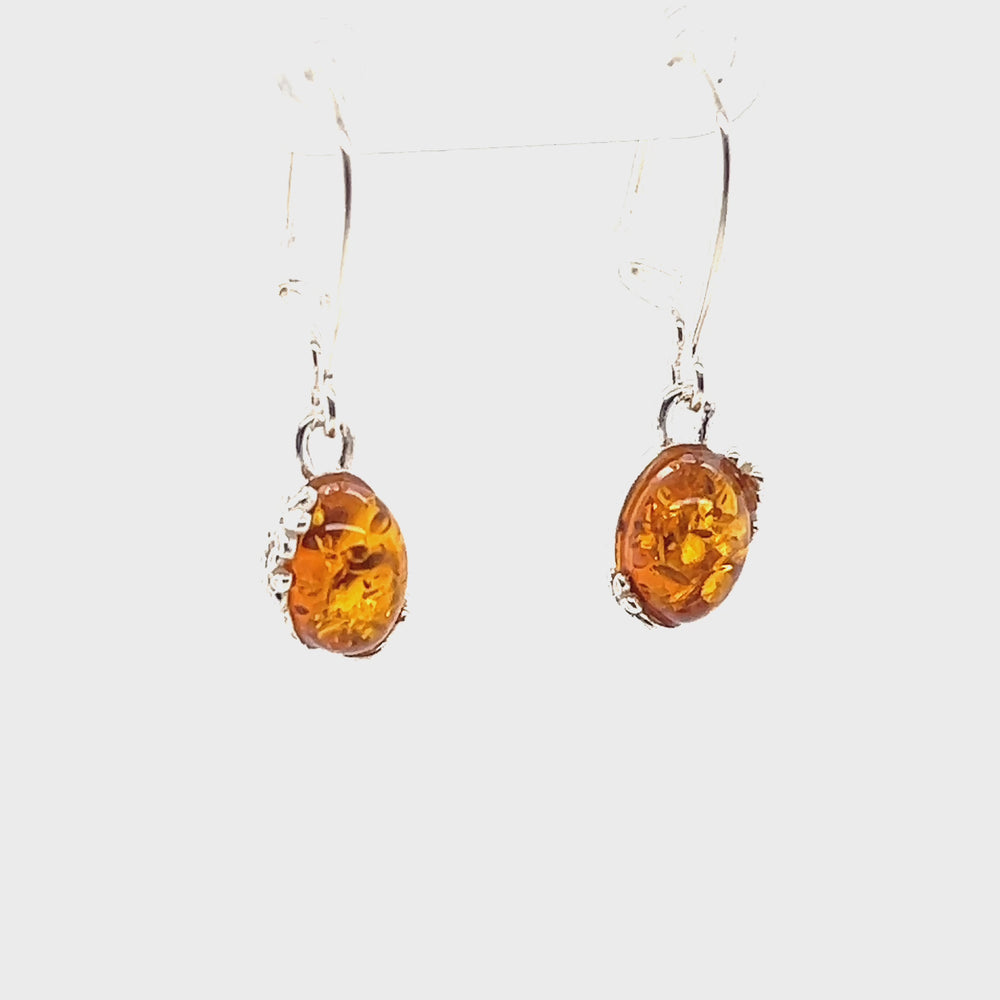 
                  
                    Load and play video in Gallery viewer, Tiny Glowing Oval Amber Earrings
                  
                