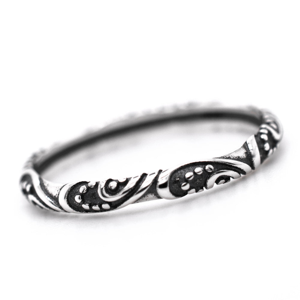 Description: This ornate ring, the Delicate Bali Style Band by Super Silver, features a vintage design with black and white swirls, made from .925 sterling silver.