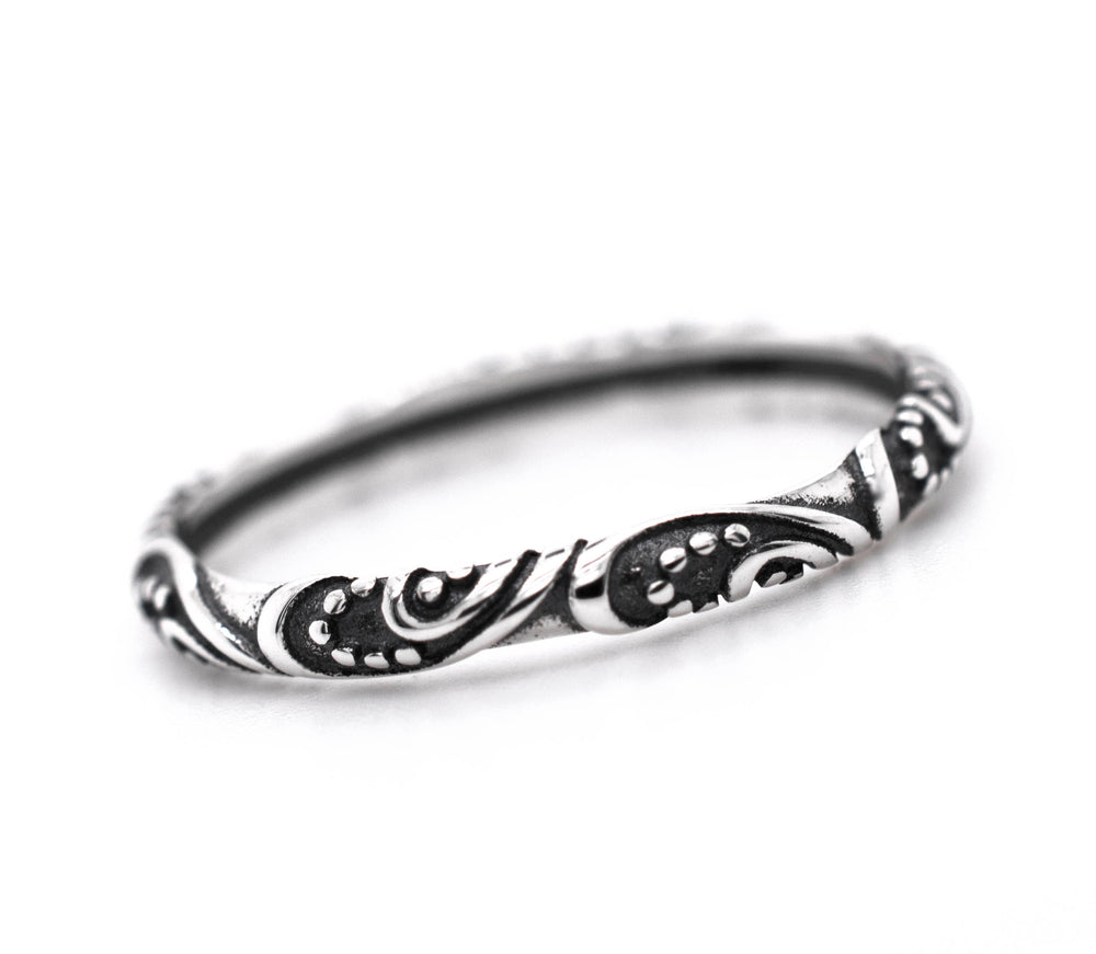 Description: This ornate ring, the Delicate Bali Style Band by Super Silver, features a vintage design with black and white swirls, made from .925 sterling silver.