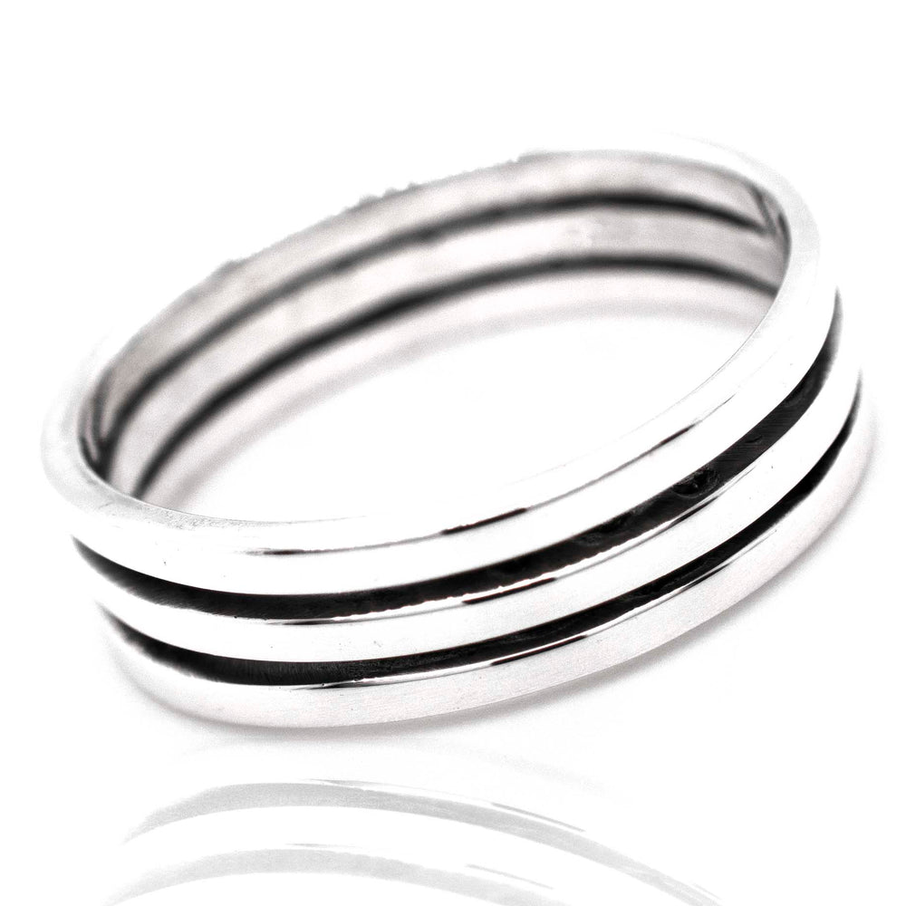 A Triple Stripe Band by Super Silver, .925 silver ring with black and white stripes.