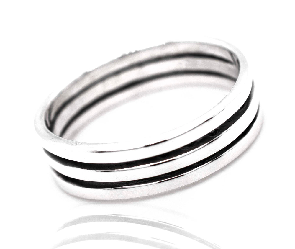 A Triple Stripe Band by Super Silver, .925 silver ring with black and white stripes.