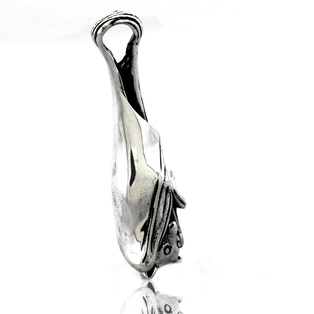 
                  
                    A Super Silver Designer Handcrafted Bat Pendant with a fish on it.
                  
                