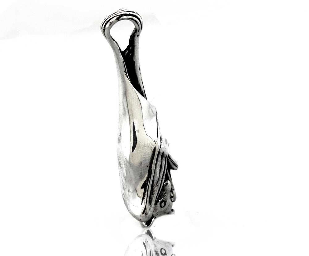 
                  
                    A Super Silver Designer Handcrafted Bat Pendant with a fish on it.
                  
                
