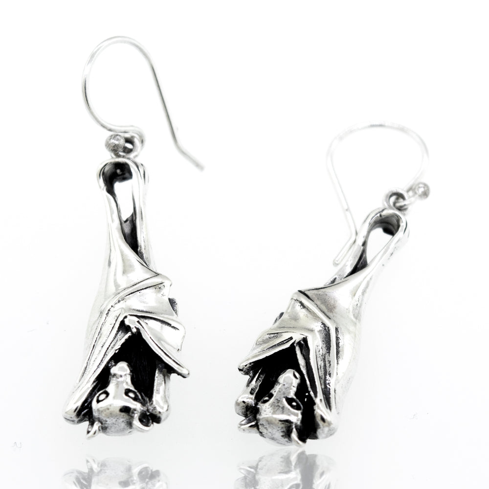 A pair of Super Silver Designer Bat Dangle Earrings featuring sleeping bats.