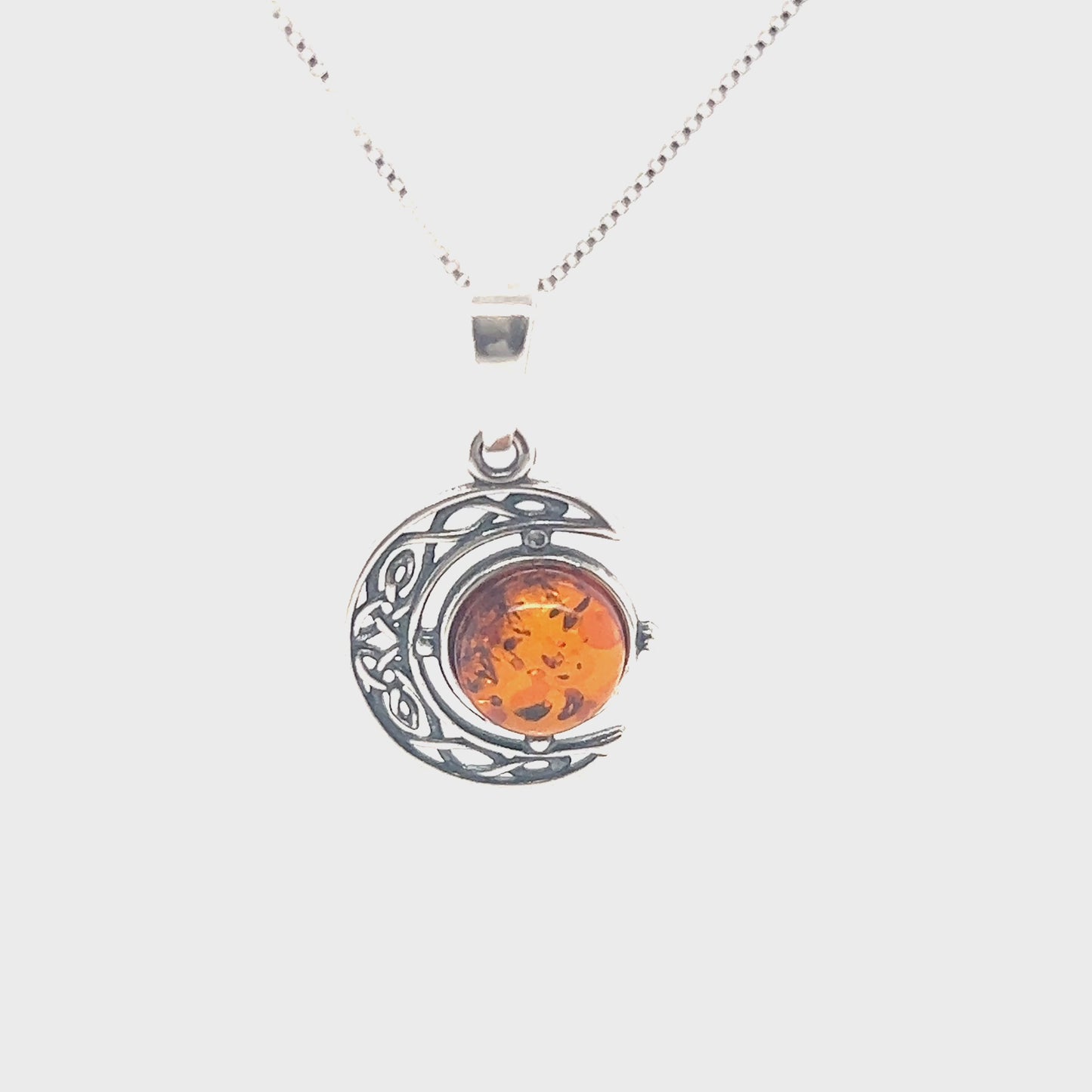 
                  
                    Load and play video in Gallery viewer, Celtic Amber Crescent Moon Pendant
                  
                