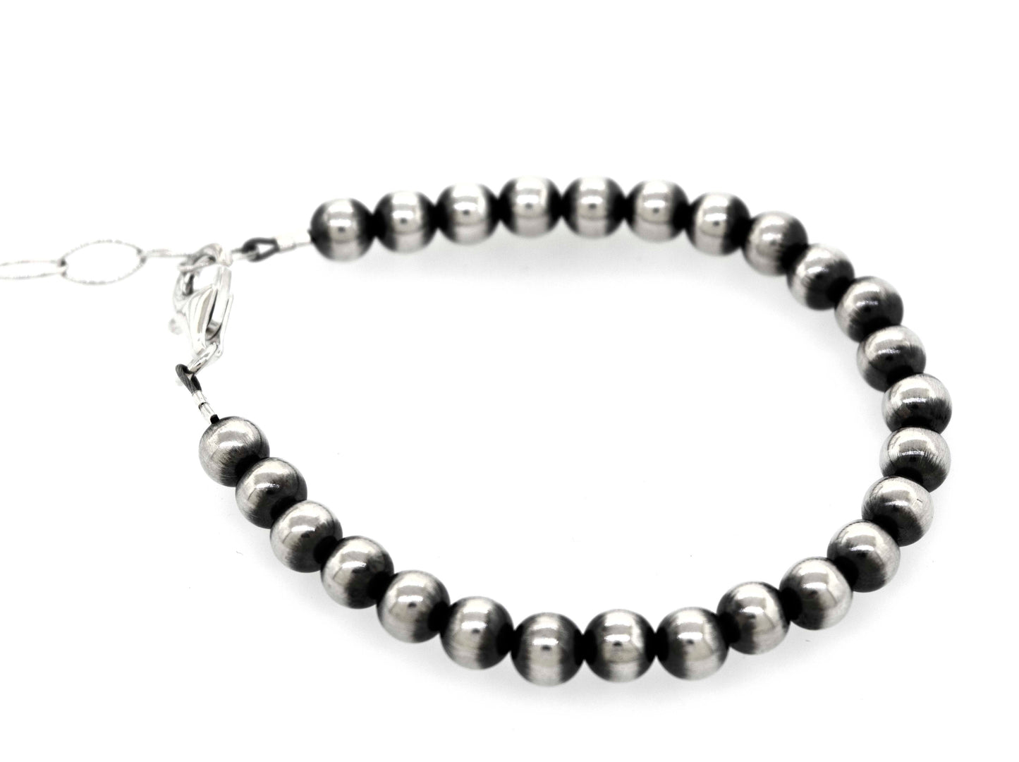 A Super Silver Handcrafted Navajo Pearl Bracelet with a vintage vibe on a white background.