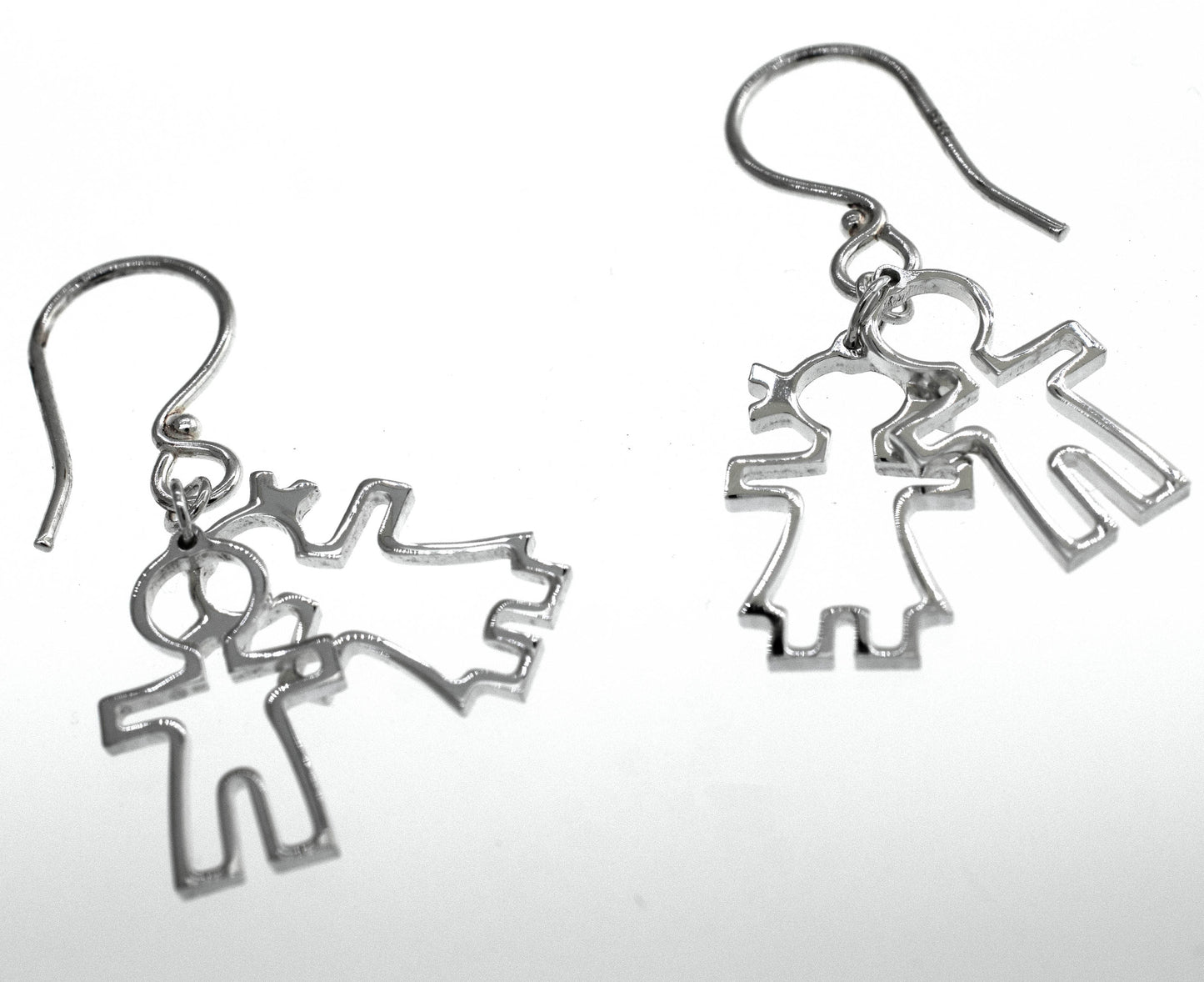 
                  
                    A pair of Super Silver Little Humans Earrings, depicting two people, embodying love and humanity.
                  
                