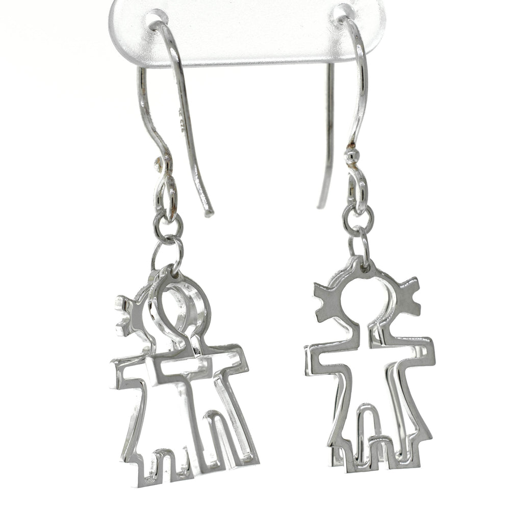 A pair of Super Silver Little Humans Earrings, featuring two people, symbolizing love and humanity.