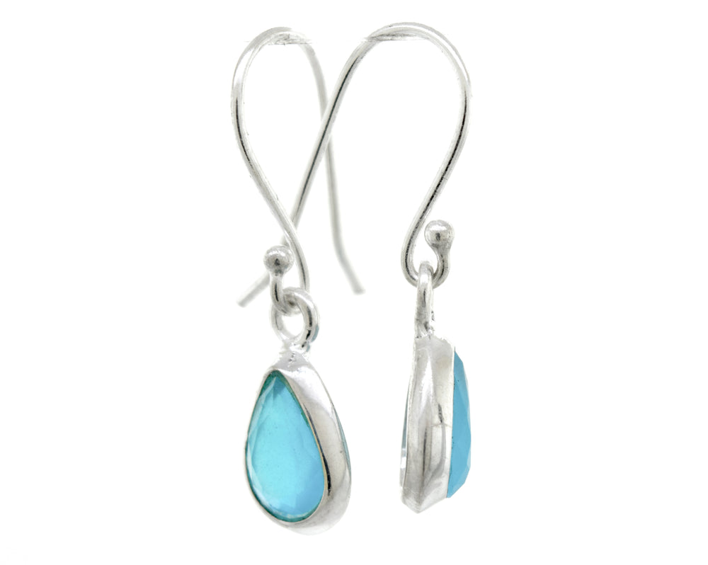 A pair of Simple Teardrop Shape Blue Chalcedony Earrings from Super Silver with turquoise stones in a sterling silver setting.
