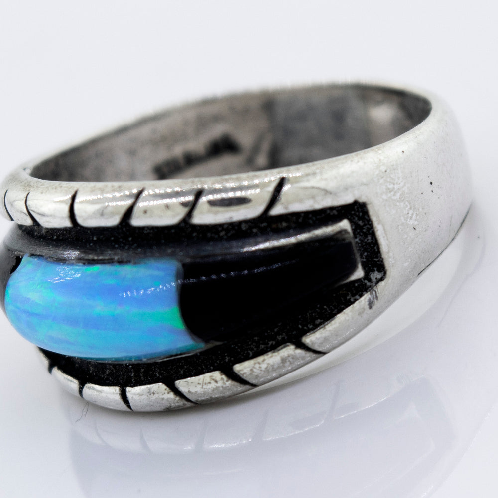 
                  
                    A Super Silver sterling silver ring with an American Made Opal Inlay Ring and black stone.
                  
                