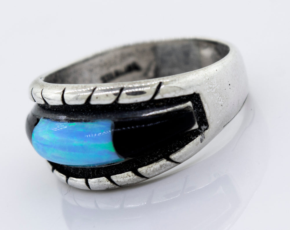 
                  
                    A Super Silver sterling silver ring with an American Made Opal Inlay Ring and black stone.
                  
                