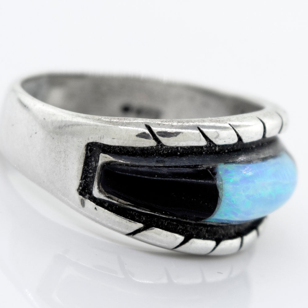 
                  
                    A Super Silver American Made Opal Inlay Ring with a blue opal.
                  
                