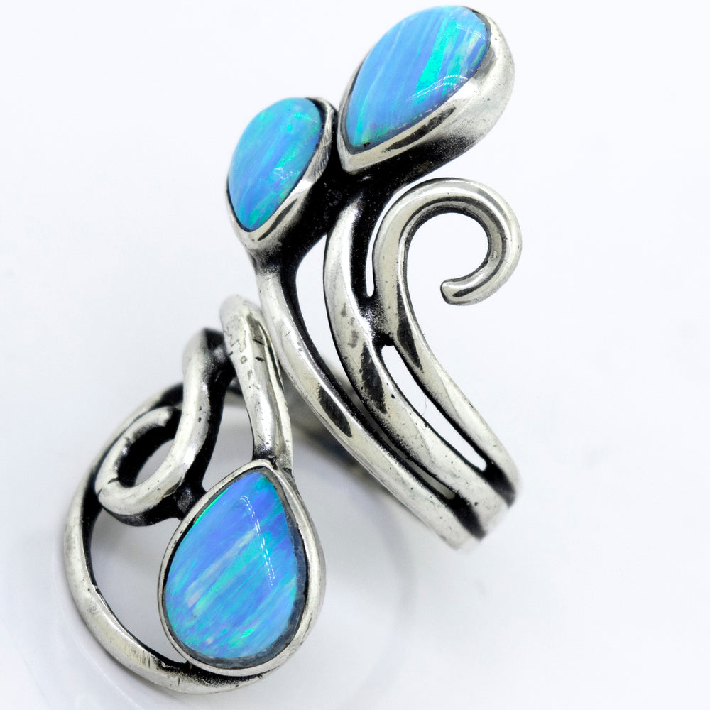 
                  
                    A Stunning Wrap-Around Opal Ring adorned with blue opal stones, by Super Silver.
                  
                