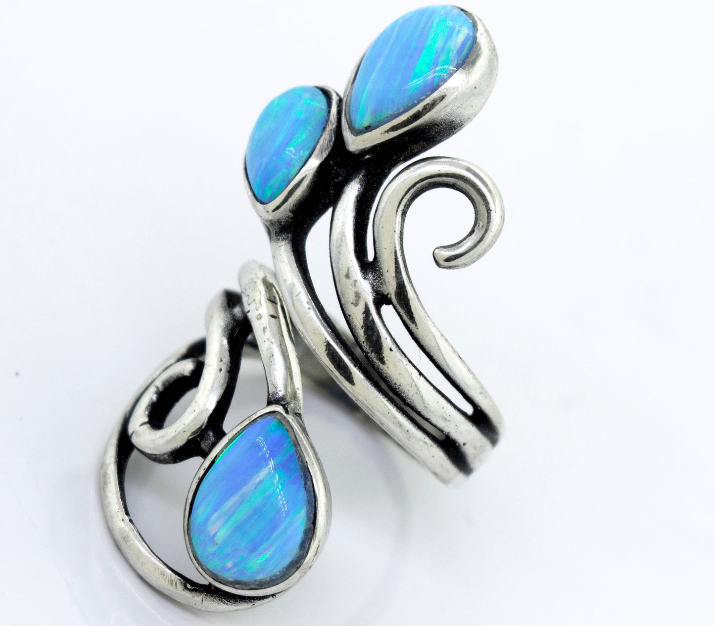 
                  
                    A Stunning Wrap-Around Opal Ring adorned with blue opal stones, by Super Silver.
                  
                