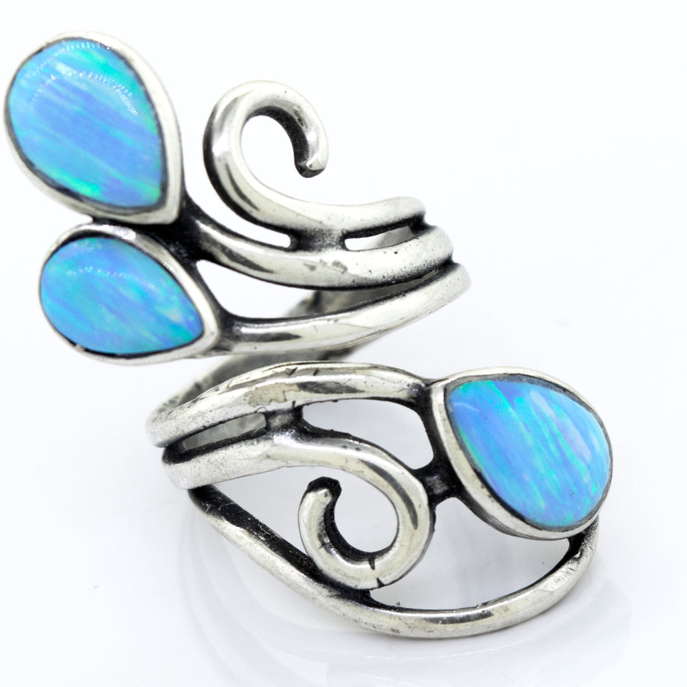 
                  
                    A Super Silver handcrafted statement ring with Stunning Wrap-Around Opal stones.
                  
                