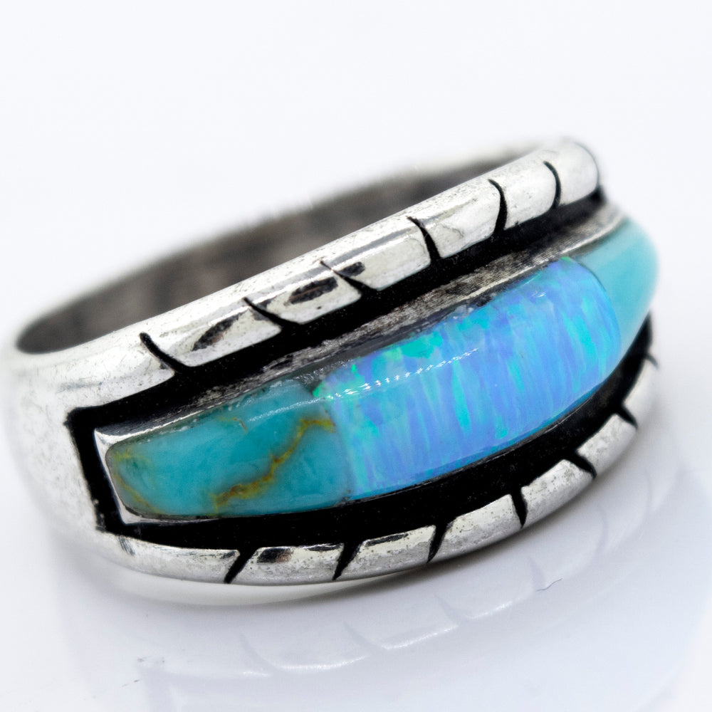 A Super Silver American Made Opal Inlay Ring with a blue opal stone.
