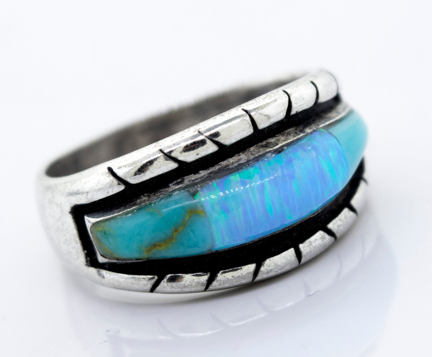 
                  
                    A Super Silver American Made Opal Inlay Ring with a blue opal stone.
                  
                