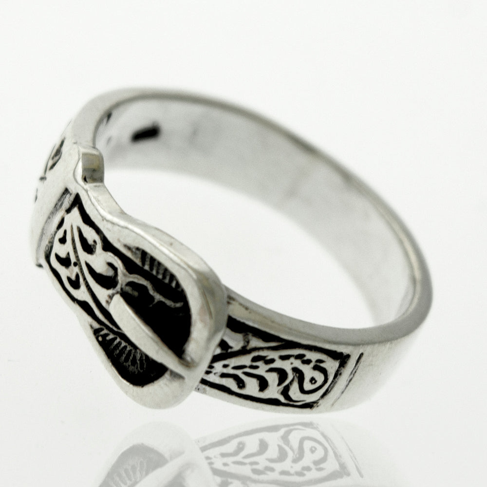 
                  
                    A Silver Belt Ring with Design with an intricate design.
                  
                