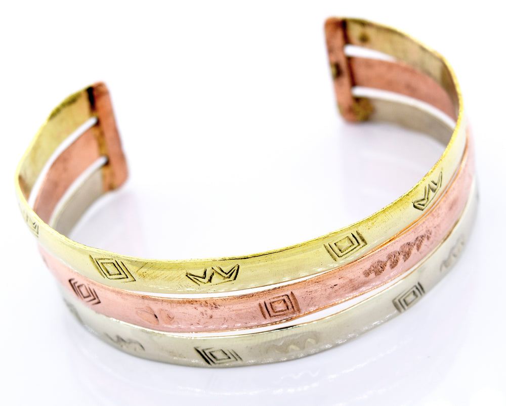
                  
                    Three Gold Plated Bracelet With Freestyle Engraving cuff bracelets in different colors with Super Silver branding.
                  
                