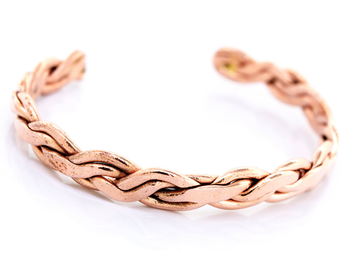 A Super Silver copper bracelet with a braided weave design.