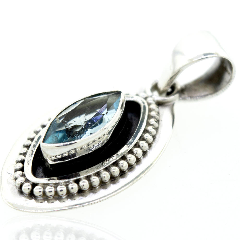 
                  
                    A beautiful Marquise Shaped Blue Topaz pendant with a beads design by Super Silver.
                  
                