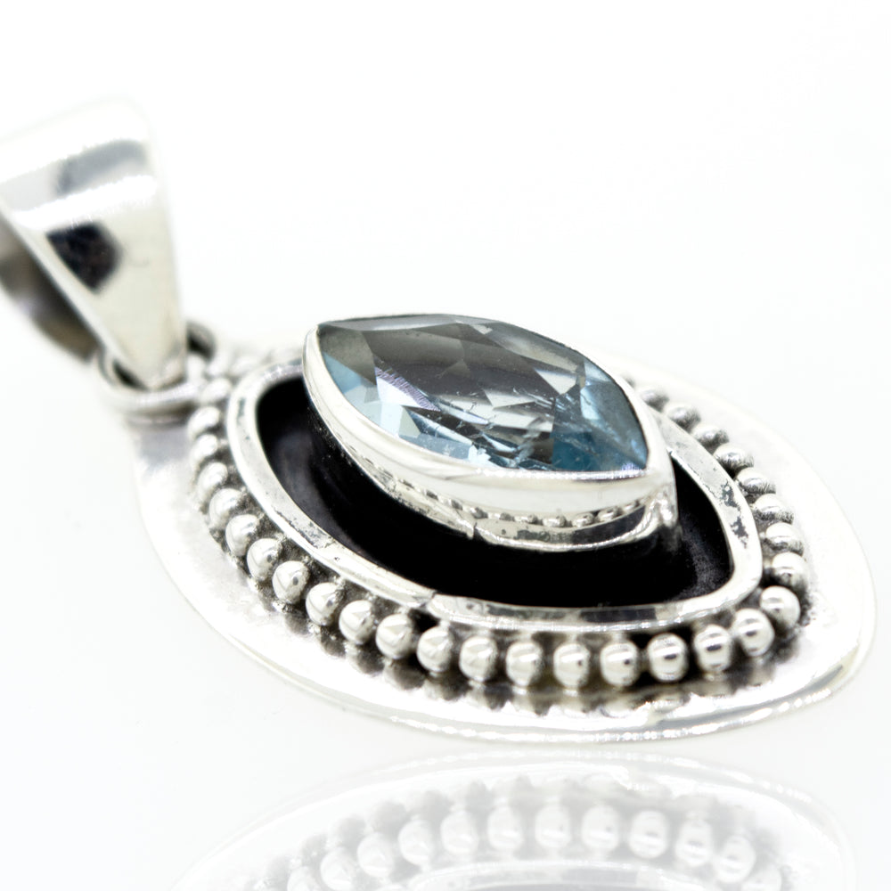 
                  
                    A Beautiful Marquise Shaped Blue Topaz Pendant With Beads Design featuring a marquise-shaped blue topaz stone by Super Silver.
                  
                